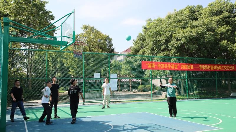 Local people playing basketball on the outdoor court in Tongxiang, China, danated by POSCO Chemical and Huayou Cobalt